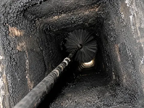 Chimney flue with heavy creosote buildup during cleaning